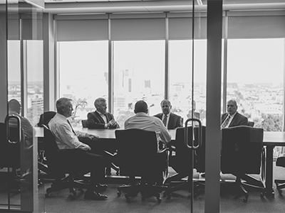a group of people sitting in front of a window